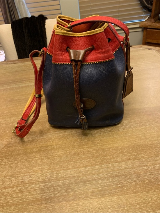 Dooney & Bourke Handbags - Dooney & Bourke Navy, Red & Yellow Leather Drawstring Bucket Bag
